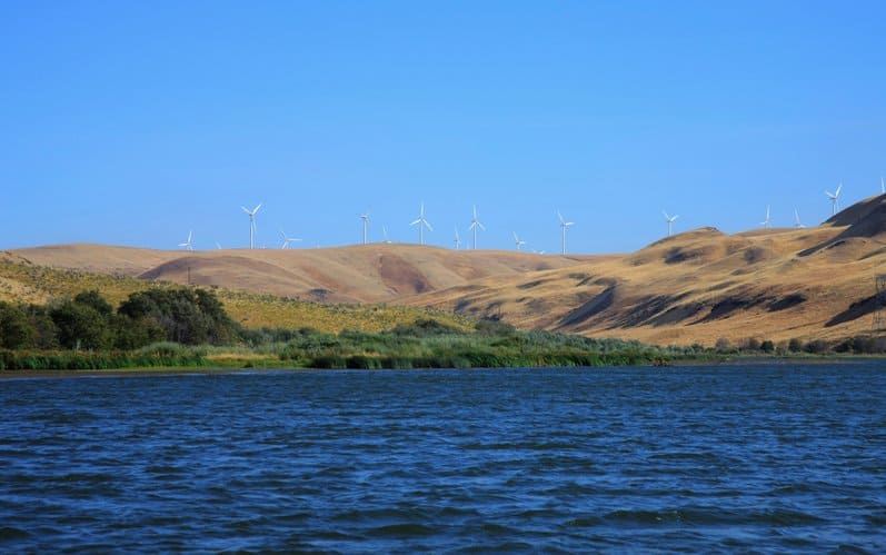 Wind Turbines On A Hill Along The Water; Dalles Oregon United States Of America